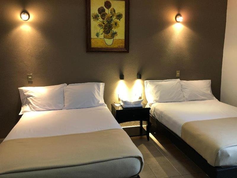 Habitación con dos camas matrimoniales